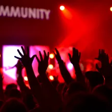 a group of people standing in front of a crowd