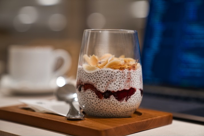 a close up of a coffee cup sitting on top of a wooden table