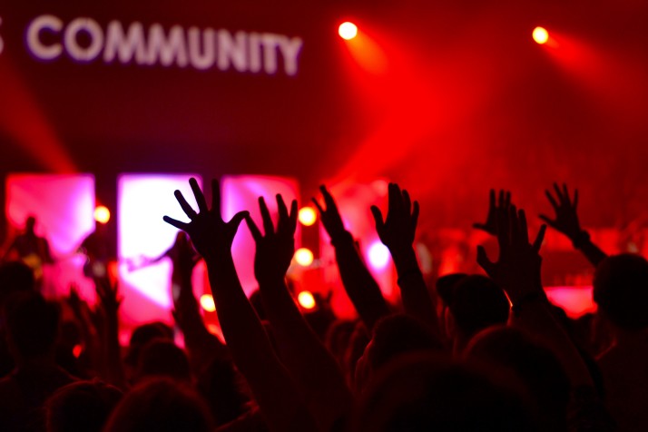a group of people standing in front of a crowd